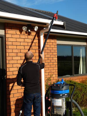 Mike Cleaning Residential Gutters